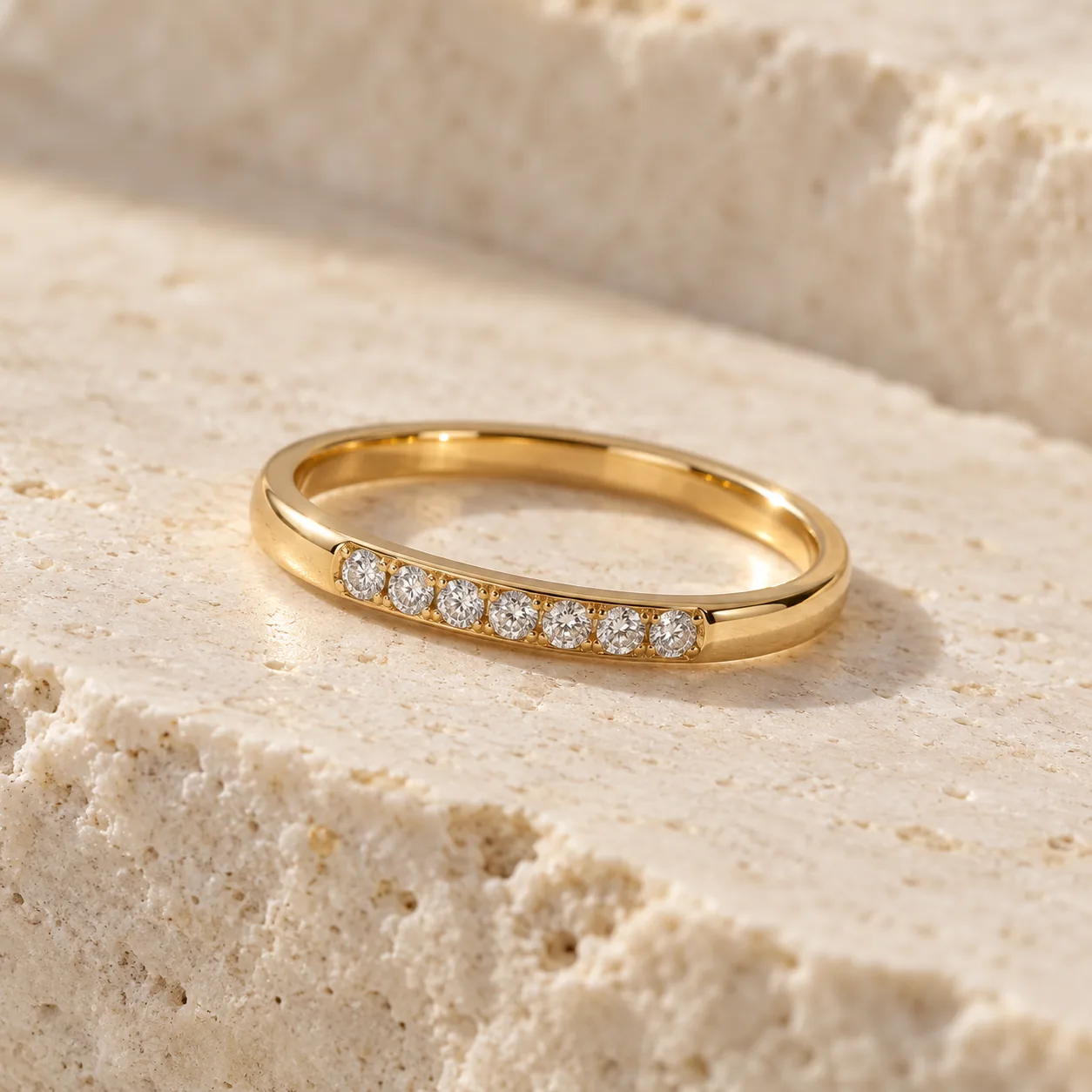 Slim yellow gold band with a short line of small white diamonds